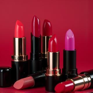 Arrangement of vibrant lipstick tubes showing a range of colors and textures
